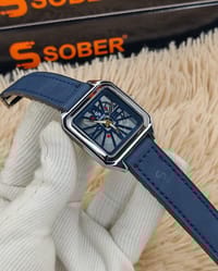 SOBER Wrist Watch with a square, skeleton dial and leather-look strap._img_0