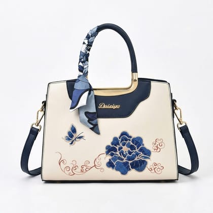 Embroidered Floral & Butterfly Top-Handle Bag with Decorative Scarf and Gold Hardware.