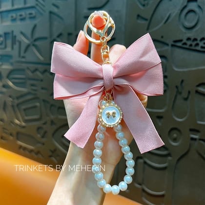 Baby pink bow pearl charm
