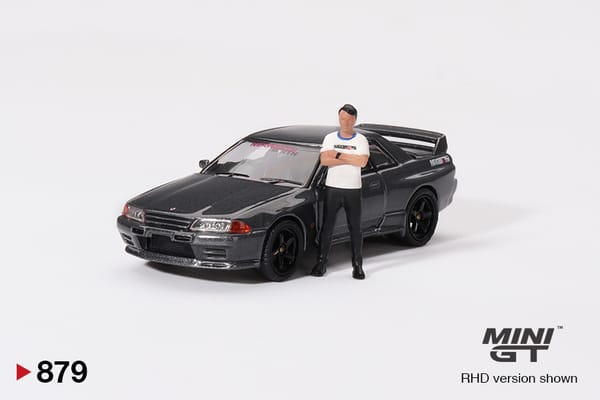 MiniGT - Nissan Skyline GT-R (R32) Gunmetal W/ Matsuda Figure Tsugio Matsuda Collection No.3 TAS 2025 Exclusive